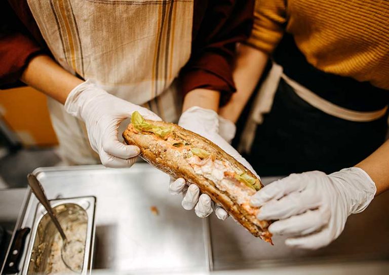 making a sandwich at fast food restaurant